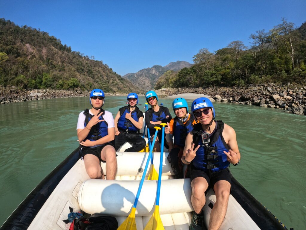 Group of friends in a raft before river rafting in Rishikesh