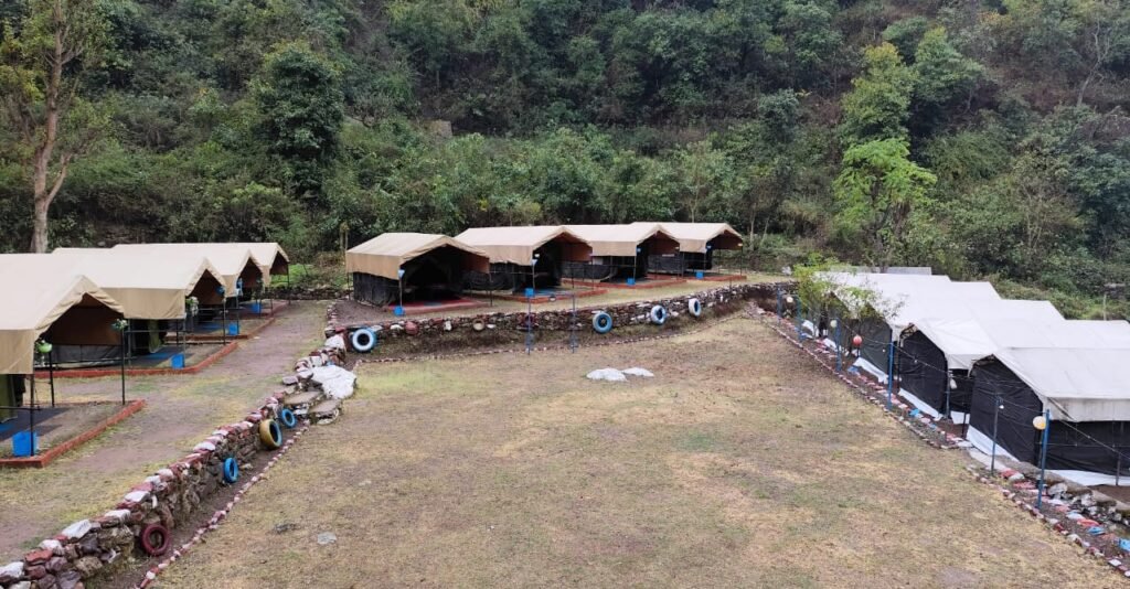 Jungle camping in Rishikesh: tents in a forest valley at the Goolar camp
