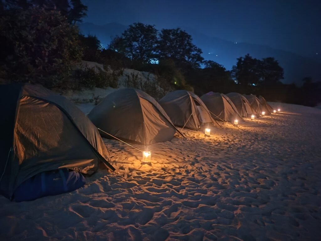 Rafting and camping in Rishikesh: tents lit up at night